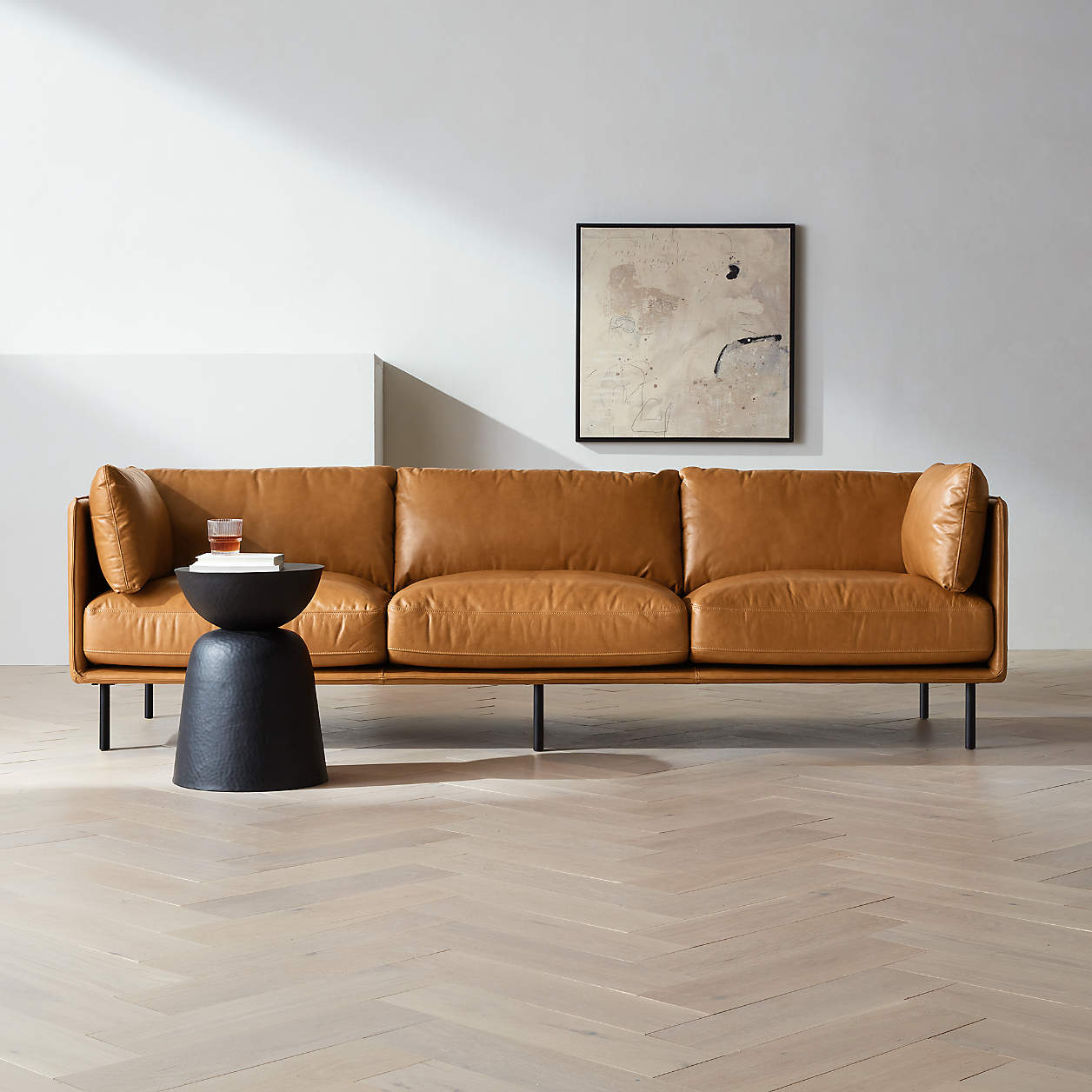 A Crate & Barrel couch in a styled living room.