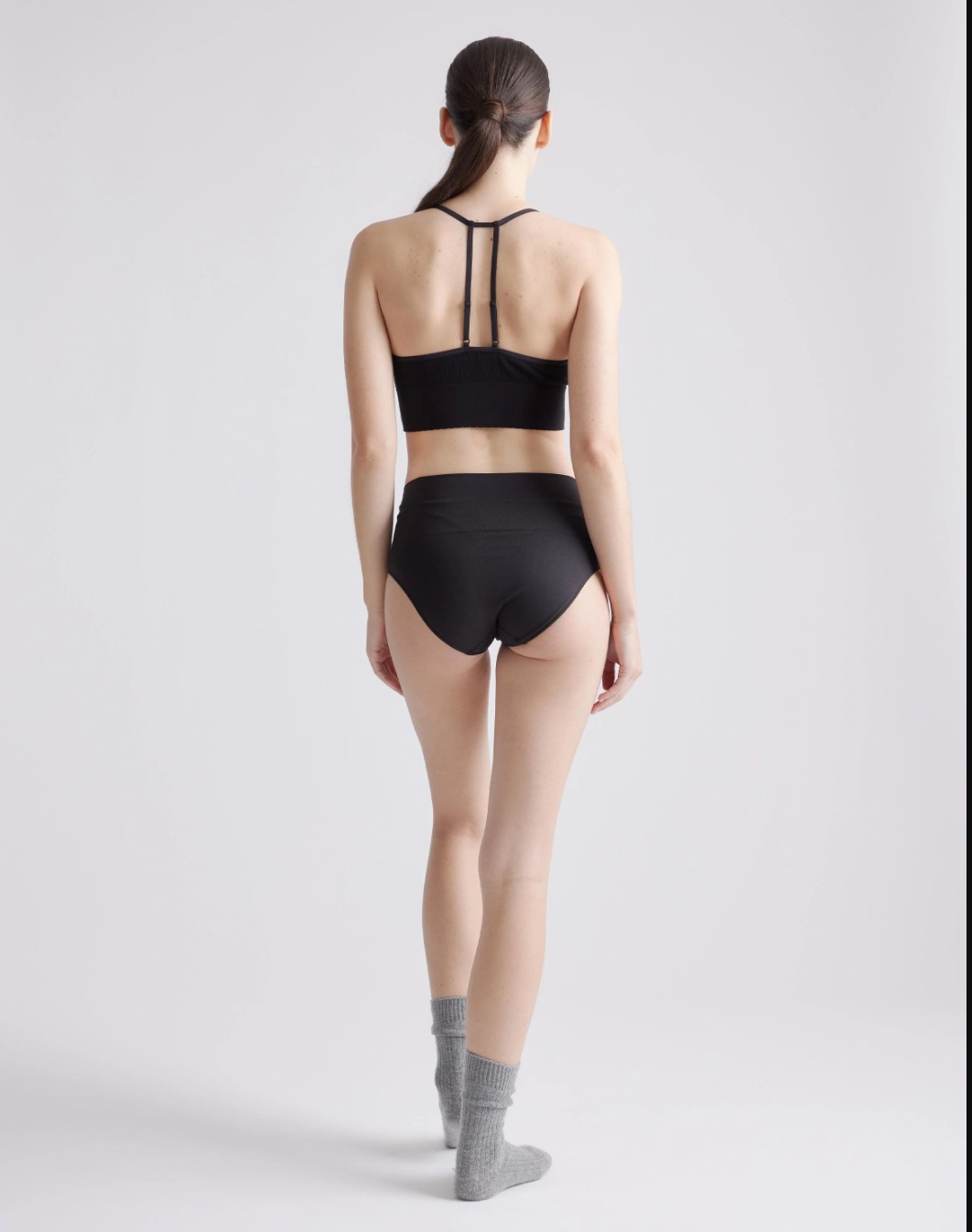 A model wearing Quince shapewear